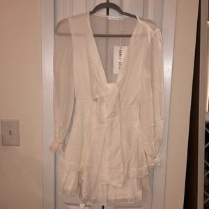 Brand new Saints & Secrets white long sleeve mini tie dress. Size small.